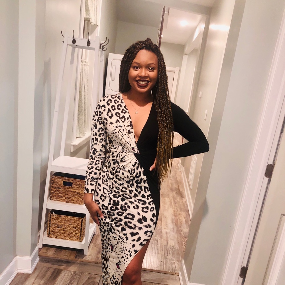 A half leopard half black dress, with a slit